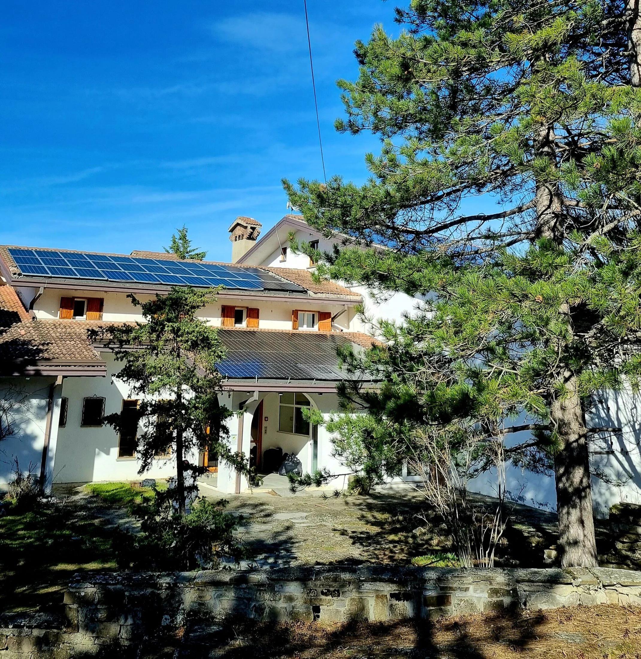 Solar panels at the Honeydew ecovillage in Maiolo, part of the shared infrastructure donations help fund